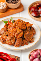 Rendang Jengkol, dogfruit simmered in spices and coconut milk. Indonesian traditional comfort food, with a spicy savory taste typical of rendang and a legit jengkol texture.