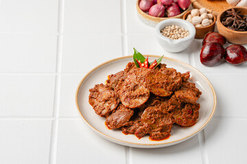 Rendang Jengkol, dogfruit simmered in spices and coconut milk. Indonesian traditional comfort food, with a spicy savory taste typical of rendang and a legit jengkol texture.