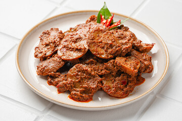 Rendang Jengkol, dogfruit simmered in spices and coconut milk. Indonesian traditional comfort food, with a spicy savory taste typical of rendang and a legit jengkol texture.