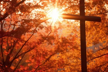 Fototapete Backstein cross christ at autumn forest tree, with rays divine lights