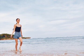 Fototapeta na wymiar woman summer running beach lifestyle young sea smile relax travel sunset