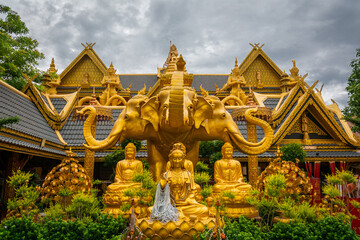 The gold three-headed elephant statue has the name Erawan at Wat Mai Supadit Tharam, Nakhon Pathom, Thailand