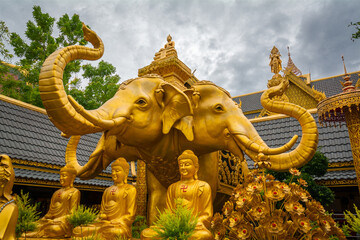 The gold three-headed elephant statue has the name Erawan at Wat Mai Supadit Tharam, Nakhon Pathom, Thailand