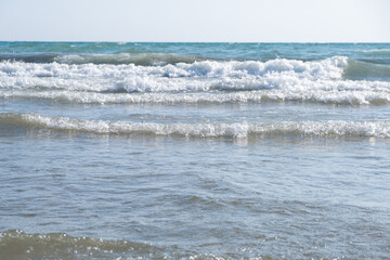 Sea waves run on the shore of the sea or ocean. Beautiful relaxing view on vacation.
