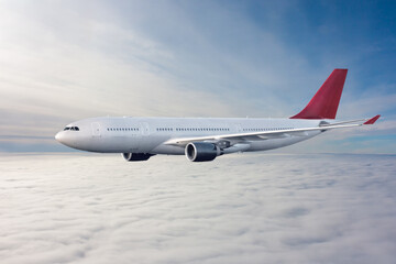 Fototapeta premium Wide body passenger aircraft flies in the air above the clouds