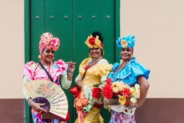 Zelfklevend Fotobehang Havana Cuban women called canasteras with habano flowers and typical costume in La Havana, Afro caribbean people in Latin America