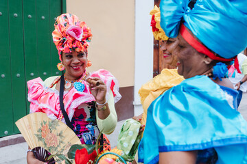 Cuban women called canasteras with habano flowers and typical costume in La Havana, Afro caribbean...