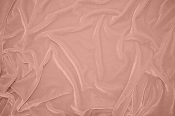 rose gold color velvet fabric texture used as background. blond color panne fabric background of soft and smooth textile material. crushed velvet .luxury golden tone for silk.pink gold.