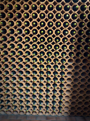 in a sparkling wine cellar many bottles of sparkling wine are stored