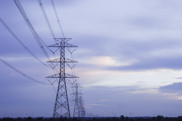 High-voltage pylons supply electricity to areas outside the city. beautiful sky