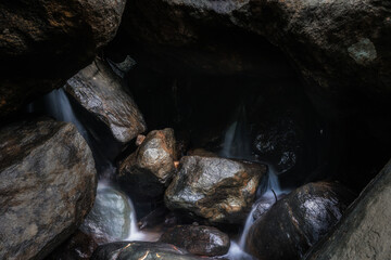 Fototapeta na wymiar a cave in the waterfall
