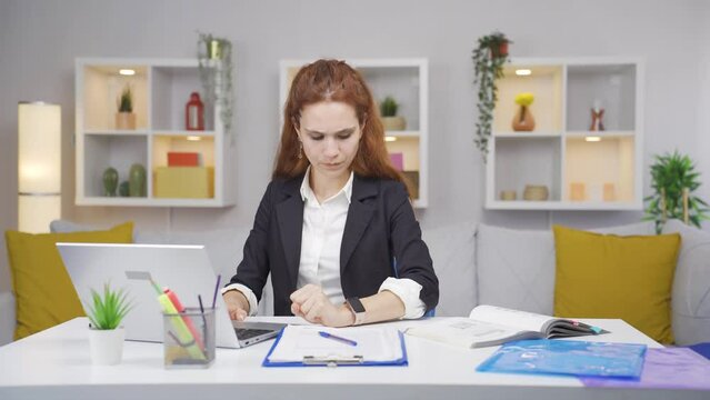Home office worker woman having a heart attack.