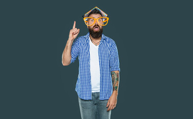 inspired with idea funny bearded man in party glasses with book on head