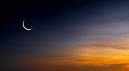 Twilight sky with crescent moon and stars, Islamic religious concept and Ramadan Kareem, Eid...