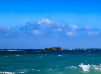 Fototapeta premium View of Owen island from the shores of Little Cayman, the smallest of the trio of the British Overseas territory of the Cayman Islands
