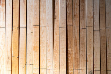 Wooden boards stored, wood timber construction material for background and texture. Stack of wooden bars