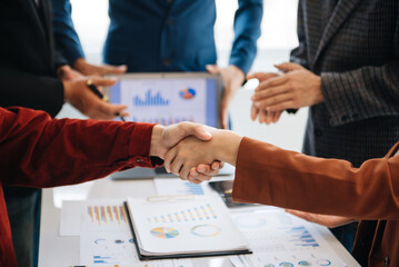 business people shaking hands during a meeting in modern office