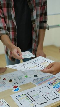 Mobile application designers team discussing, brainstorming for new approaches and ideas together