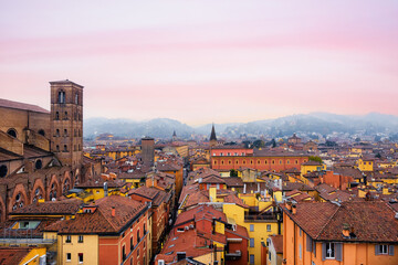 Top view from the drone of Via Indipendenza in the city of Bologna at sunset. Best city in Italy Europe in 2022. Wonderful romantic panorama of old city. University, art, cuisine. Traveling concept  - obrazy, fototapety, plakaty