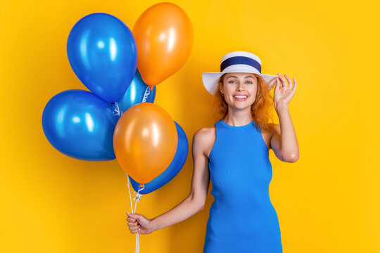happy woman with balloons at summer birthday. photo of woman with balloons at summer
