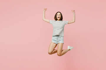 Full body young happy overjoyed fun cool caucasian woman she wears casual clothes t-shirt jump high...