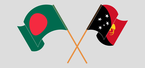 Crossed and waving flags of Bangladesh and Papua New Guinea