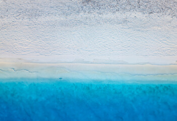 Fascinating blue and white beach through drone eyes