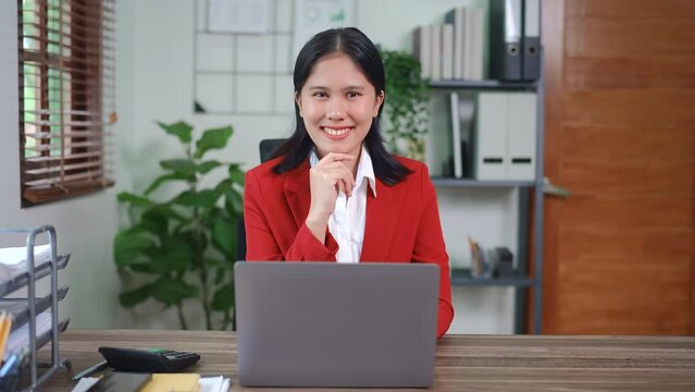 financial, Planning, Marketing and Accounting, portrait of Asian employee checking financial statements using documents and computer at work.