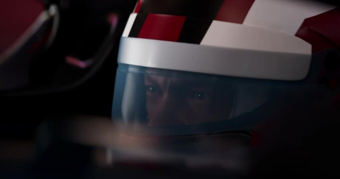 ECU Portrait of modern race car pilot driving fast during a race. Realistic 3d rendering