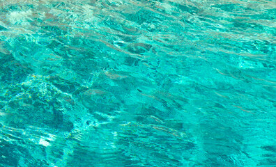 defocused summer pool background. defocused summer pool background with ripples.
