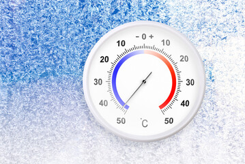 Celsius scale thermometer on a frozen window shows minus 47 degrees
