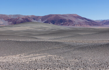 Puna - off road adventure through a bizarre but beautiful landscape with a field of pumice, volcanic rocks and dunes of sand in the north of Argentina