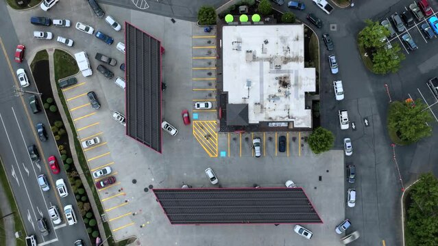 Busy gas station. Aerial hyperlapse of cars and traffic refueling during fuel shortage in America. Drone top down timelapse.