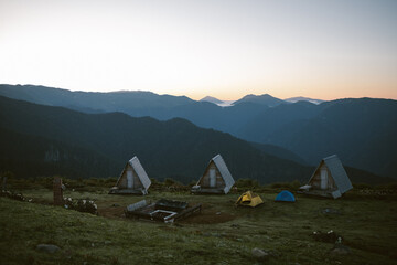 High mountain glamping in the early morning at dawn.