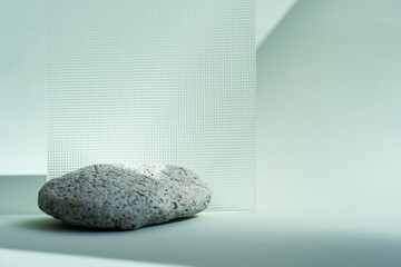 Composition empty podium material wood stone and glass geometric shape. Pastel green background. Beautiful background made of natural materials for product presentation.