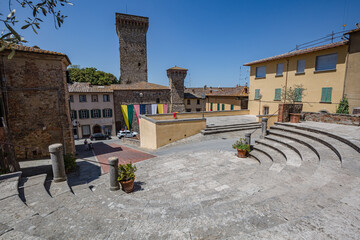Lucignano, Italy - 23 of May 2022: Walking small historic town Lucignano. View of central square of the city.