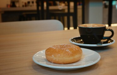sugar donut with hot latte coffee background