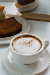 closeup hot cappuccino coffee on white background