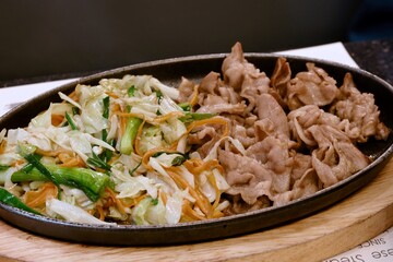 fried sliced pork with teriyaki sauce and salad, japan style