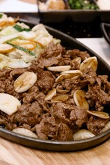 fried sliced beef with teriyaki sauce and salad, japan style