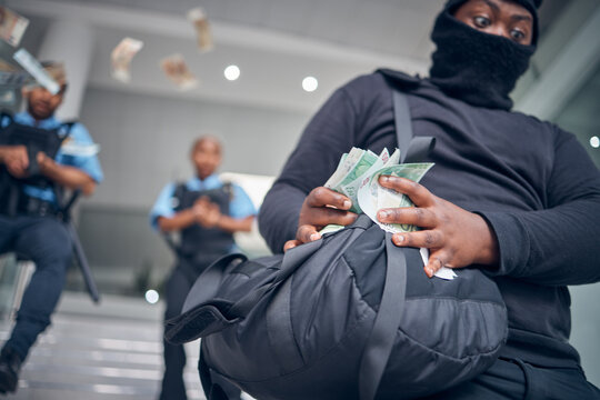 Bank, robbery and police running after criminal for justice, punishment and safety, serious and danger. Crime, corruption and man robber with stolen money running for security, law or financial loss