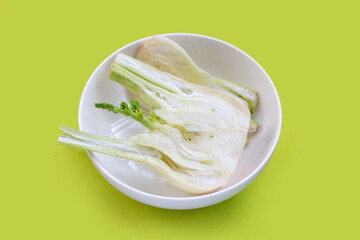 Fresh fennel bulb on green background