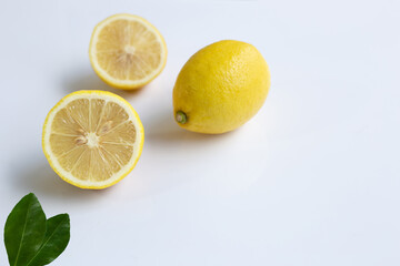 Ripe lemons on white background.