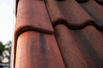 Red concrete tile roofing. Construction and repair
