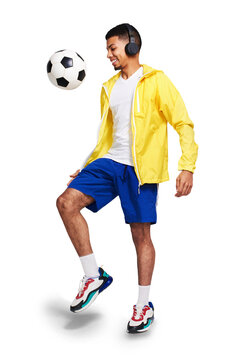 Isolated young man, juggle soccer ball and headphones with music by transparent png background. Happy football player, kick and listening with audio tech with streaming service, fitness and sports