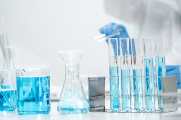 medicine research in chemical laboratory, chemist scientist working with liquid experiment test analysis by using scientific tube beaker glassware, chemistry science pharmaceutical medical lab concept