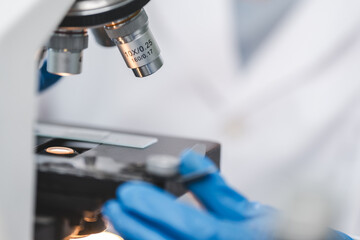 microscope tool technology using in laboratory, scientific equipment for microbiology science research, medicals scientist analysing experiment in term of biology or biotechnology for medicine test