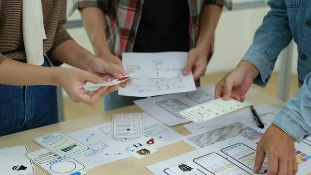 Team of developer planning application development framework at design studio