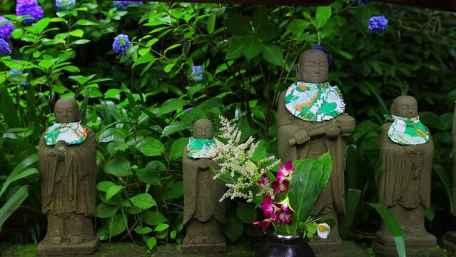 miniature stone Buddha statues in a traditional Japanese shrine in Kamakura, zen meditation, Japanese culture, religious architecture in Japan