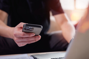 Social media and digital online concept, man using smart phone. The concept of living on vacation and playing social media. Social Distancing ,Working From Home